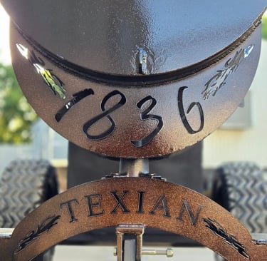 metal cut outs that say 1836 texian
