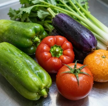 Close-up of fresh, vibrant vegetables arranged neatly on a sleek white surface.