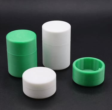 Close-up of a sleek 3D printed cannabis grinder with intricate details.