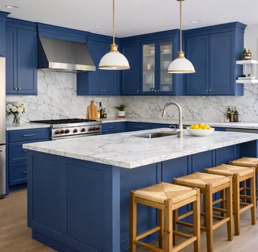 Modern kitchen with blue cabinets, marble countertops, and a large island with wood bar stools.