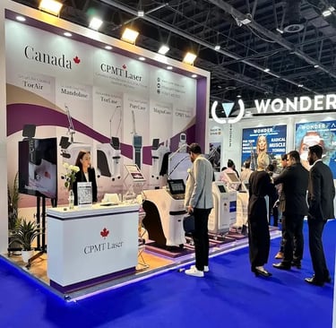 High-tech custom stand for CPMT Laser Canada with modern blue LED under-lighting and product presentation zones.