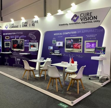 Premium medical computer booth for Curevision at Medica Düsseldorf with modern ambient backlit walls and workspace.