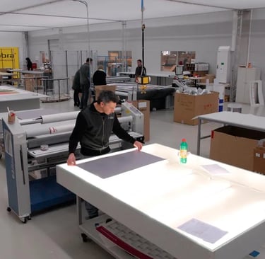 a visualizer man working on a large table top in germany