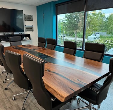 Live edge Black Walnut conference table with black epoxy river and custom steel legs