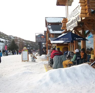 a group of people standing outside a building cerro catedral bariloche argentina