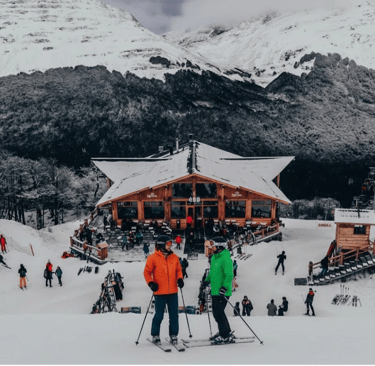 a group of people standing in the snow cerro castor