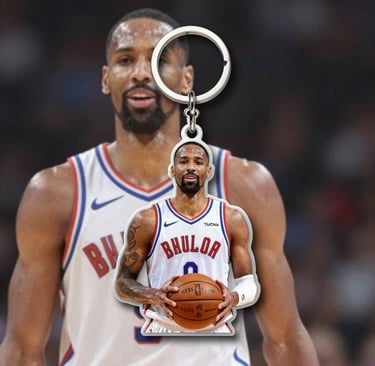 Colorful customized PVC and acrylic keychains hanging from a mint-green background