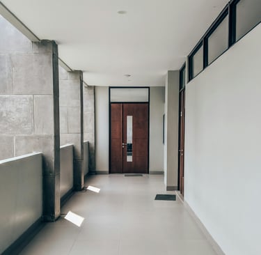 a hallway with a door and a door way