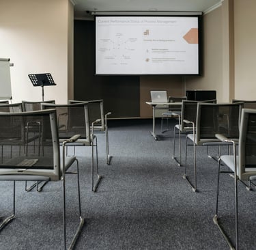 a conference room with chairs and a projector
