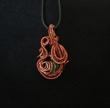 Peridot wrapped in Copper Wire