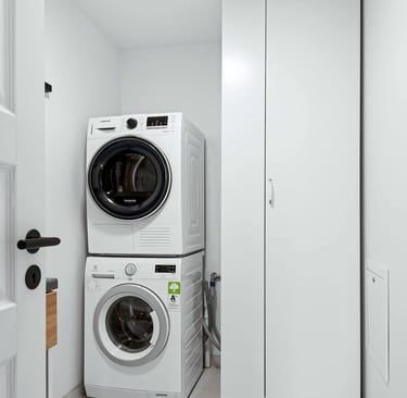 Laundry machines in an our adult family home, laundry room for resident clothing care and daily living support