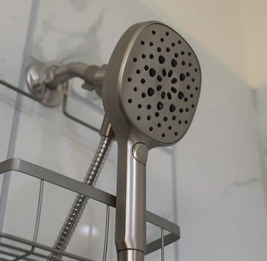 Senior care modern bathroom with white tiles, comfortable shower heads.