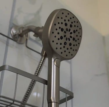 Senior care modern bathroom with white tiles, comfortable shower heads.