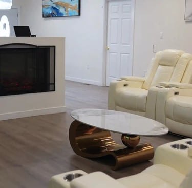 Bright living room in adult family home with comfortable seating and open space for residents.