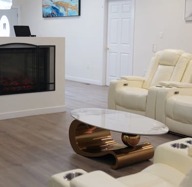 Bright living room in adult family home with comfortable seating and open space for residents.