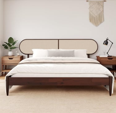 Mid-century modern dark wood bed frame with a woven cane headboard in a bright minimalist bedroom.