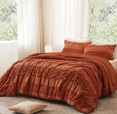 Tufted terracotta duvet cover set with textured geometric embroidery in a bright, modern bedroom.