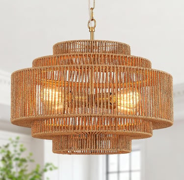 A tiered round jute rope chandelier with glowing Edison bulbs and a gold finish.