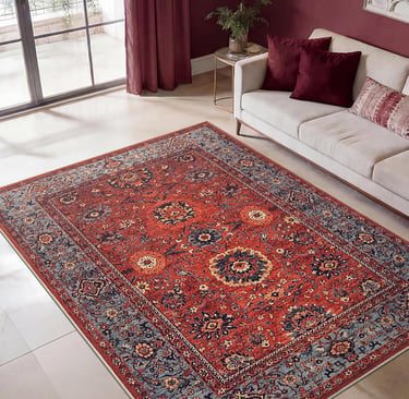 Traditional red oriental area rug with ornate floral patterns in a modern living room setting.