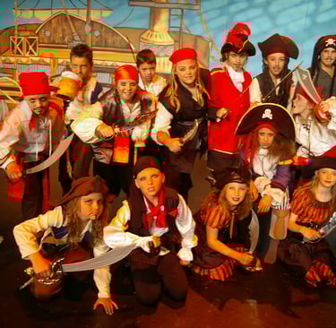 Students posing on stage for Treasure Island