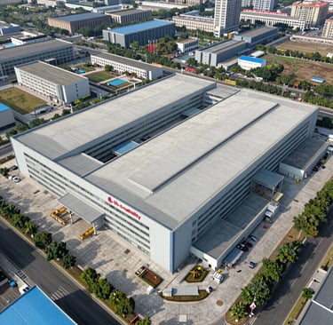 Modern aluminium windows and doors lined up ready for shipment in a spacious factory