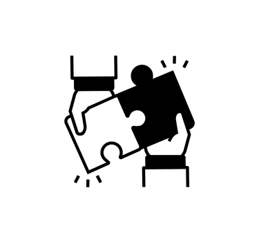 Two puzzle pieces coming together - collaboration