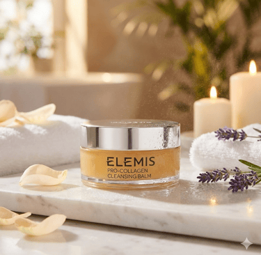 Elemis Pro-Collagen Cleansing Balm on marble with lavender and candles in a spa setting.