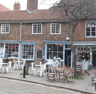 city scene in york of a pavement cafe