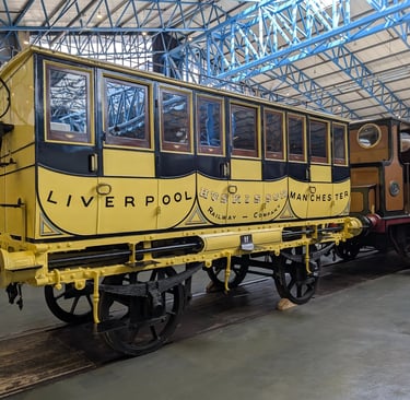 a view of a very old railways carriage in the national railway museum in York