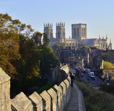 image of the city of York taken from the city walls. You can walk along the top of the wall