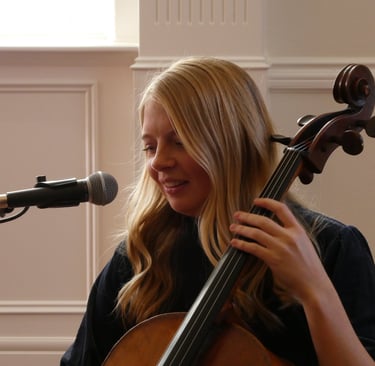 Mandy Hofheins singing as she performs her cello at weddings in Utah