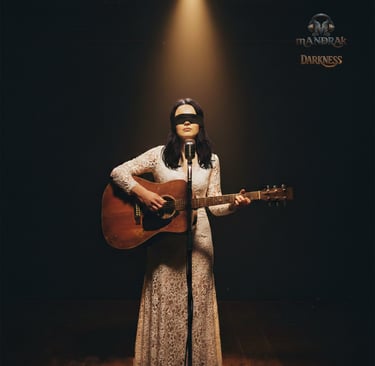 darkness by mandrak, girl with a guitar on stage, she is blind with a cloth over her eyes