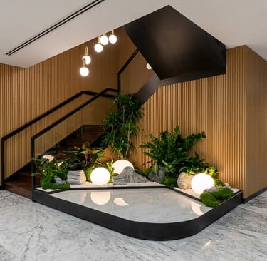 Indoor Zen garden design at The Gardens South Tower KL with glowing orb lighting.