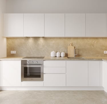 Modern minimalist white kitchen with handle-free cabinets, built-in oven and beige stone backsplash.