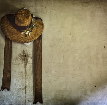 Photo of straw hat on wall
