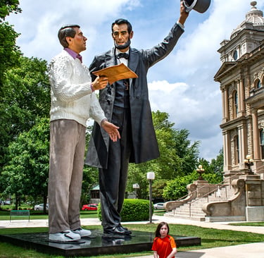 Photo of A. Lincoln and boy on scooter