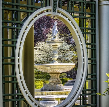 Photo of garden lattice framing a water fountain
