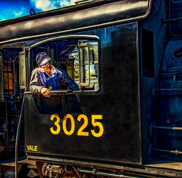 Photo of train engineer in engine window