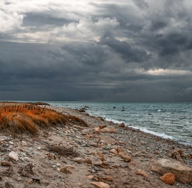 Photo of deserted beach with storm clouds approaching
