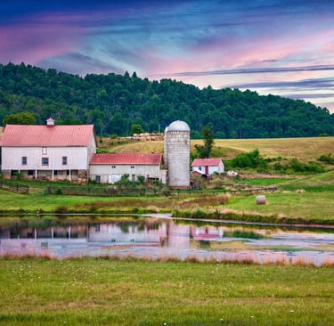 Photo of barn complex in early morning light