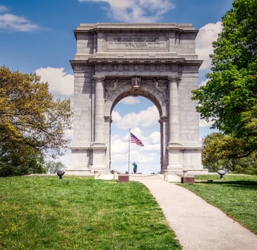 Photo of Revolutionary War memorial with US flag