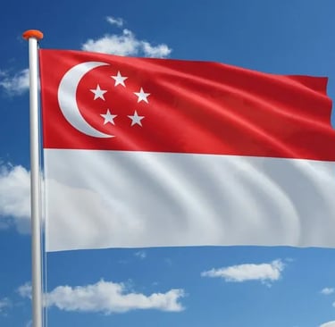 Magnificent Singapore national flag waving in the blue sky with red and white colors, crescent moon and five stars visible
