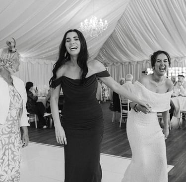 bridesmaid and guest laughing on the dancefloor at London Shenley Club