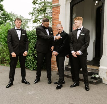 groomsmen standing in front of highley Manor