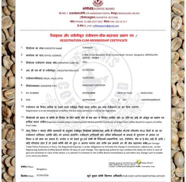Official Coffee Board of India registration-cum-membership certificate for TORNADO exporter on a bed of green coffee beans.