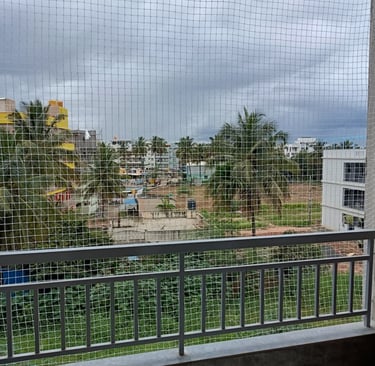 Evening shot of a safety net glowing softly under ambient city lights in Mumbai.