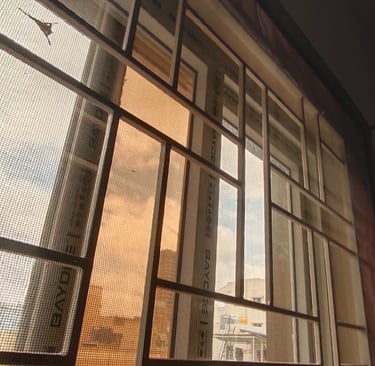 Close-up of a velcro mosquito net neatly fitted on a balcony door in Bangalore.