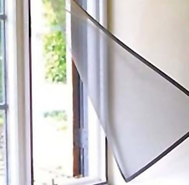Wide shot showing a balcony fully covered with mosquito nets secured by velcro strips.