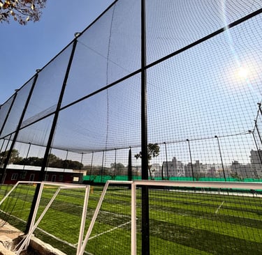 Sports net installed at a local park, designed to keep balls safe within the play area.