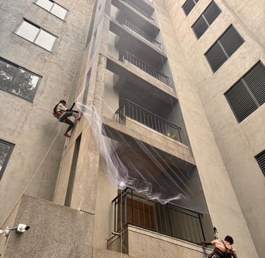 Apartment duct area wrapped neatly with fine mesh netting to prevent bird entry.